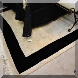 DR10. Black and ivory wool rug. 